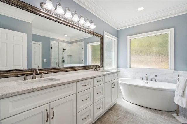 bathroom featuring crown molding, shower with separate bathtub, vanity, and tile patterned flooring