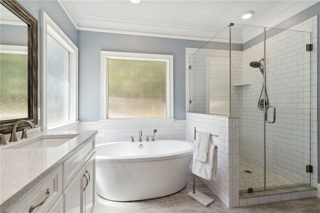 bathroom featuring vanity, separate shower and tub, and ornamental molding