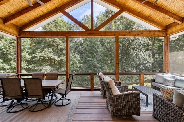 sunroom / solarium featuring wooden ceiling, a wealth of natural light, and vaulted ceiling with beams