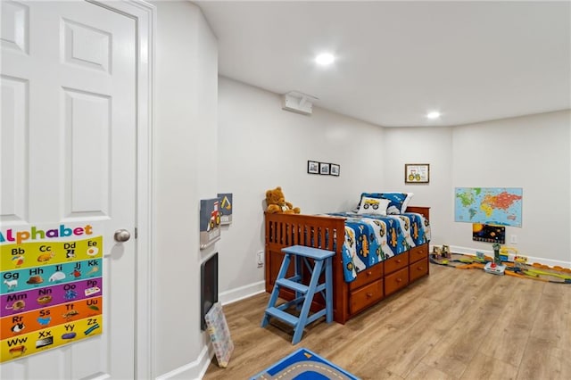 bedroom with light hardwood / wood-style flooring