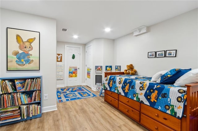 bedroom with light hardwood / wood-style flooring