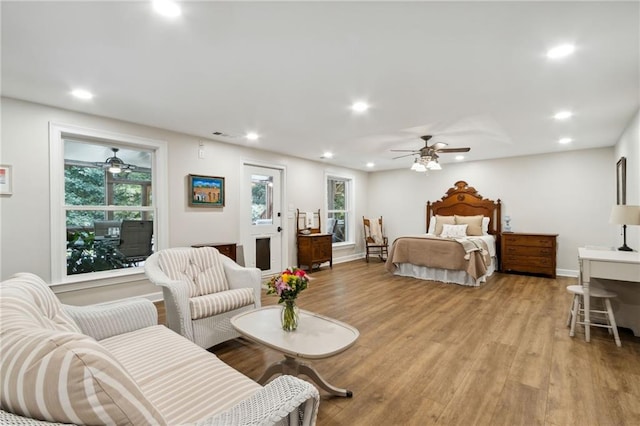 bedroom featuring hardwood / wood-style flooring and ceiling fan