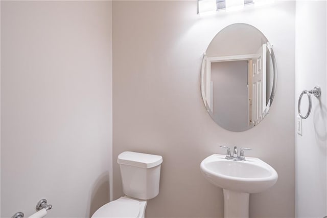 bathroom with sink and toilet