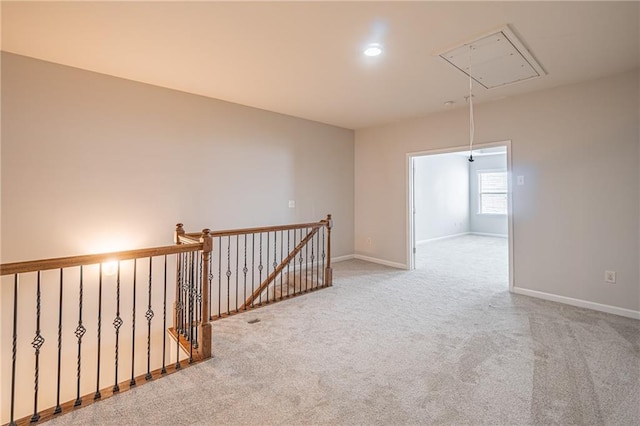 empty room with light colored carpet