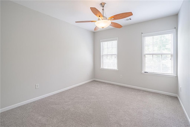 unfurnished room with carpet flooring and ceiling fan