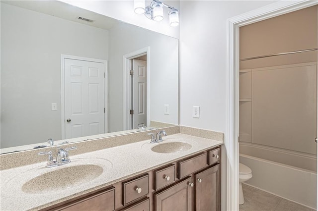 full bathroom featuring bathtub / shower combination, tile patterned floors, vanity, and toilet