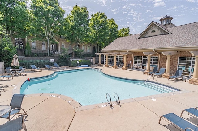 view of swimming pool with a patio area