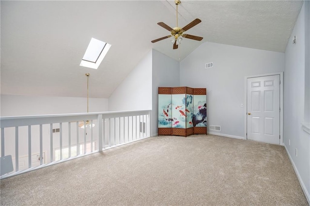 2507 Albion Farm Way, Duluth, GA 30097 - additional living space with a ceiling fan, a skylight, carpet, high vaulted ceiling, and baseboards