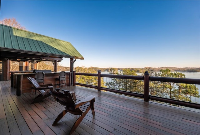 wooden deck with a water view