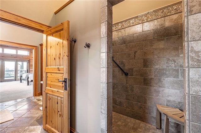 bathroom featuring a tile shower