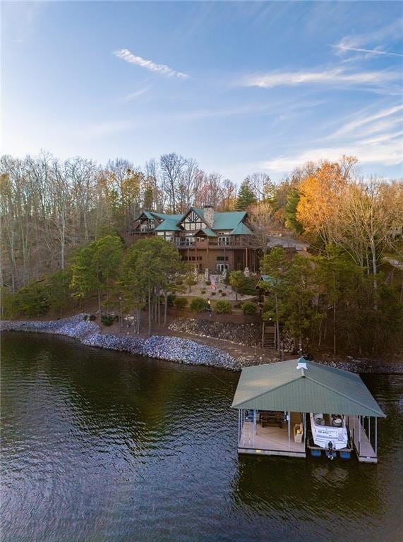 dock area with a water view and boat lift