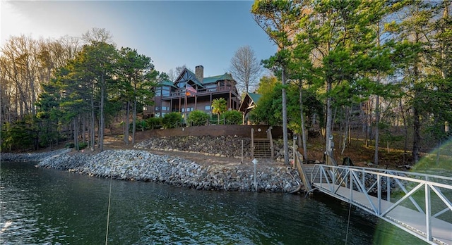 dock area featuring a water view and stairs