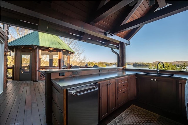 deck with area for grilling and a sink