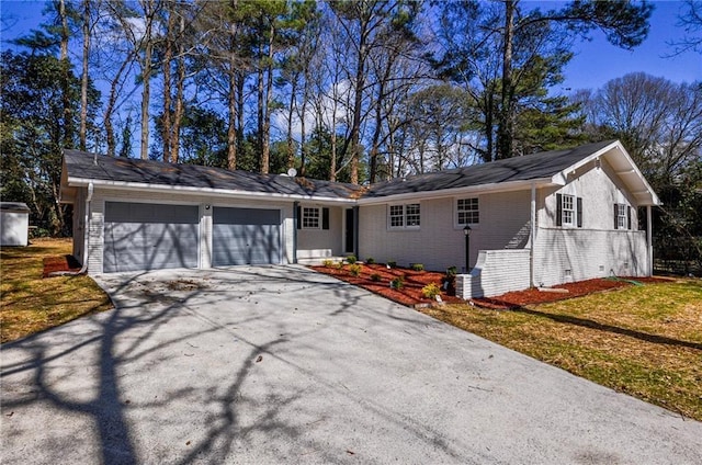ranch-style house featuring a garage