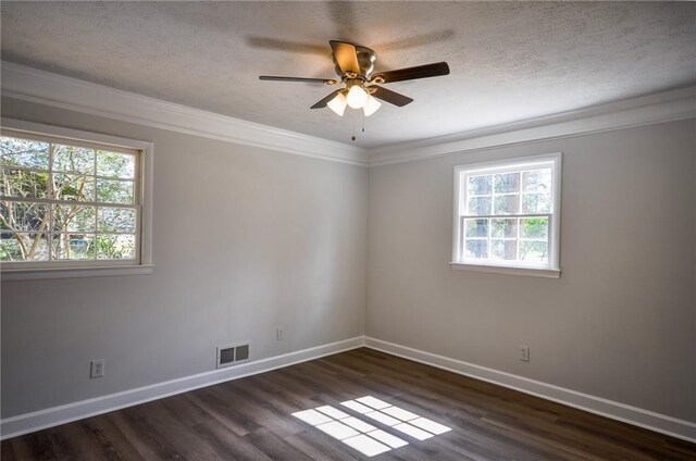 spare room featuring ceiling fan, crown molding, dark hardwood / wood-style flooring, and plenty of natural light