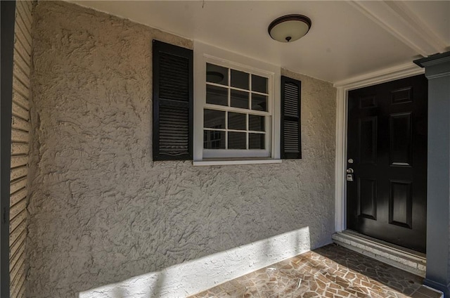 entrance to property featuring a porch