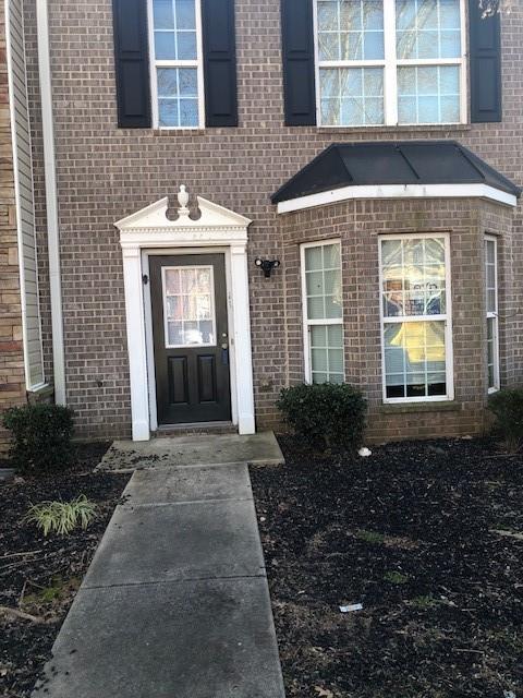 1843 Grove Way, Hampton, GA 30228 - entrance to property featuring brick siding
