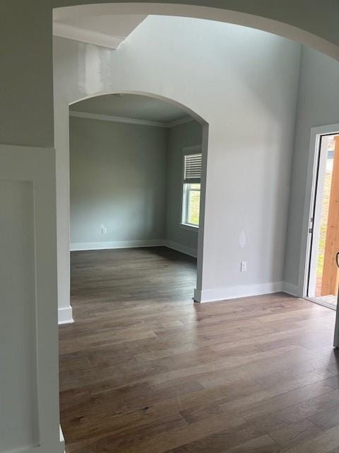 129 Silvercrest Dr, Acworth, GA 30101 - unfurnished room featuring arched walkways, crown molding, wood finished floors, and baseboards