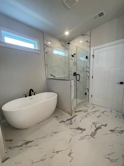129 Silvercrest Dr, Acworth, GA 30101 - bathroom featuring a marble finish shower, a freestanding tub, marble finish floors, baseboards, and recessed lighting