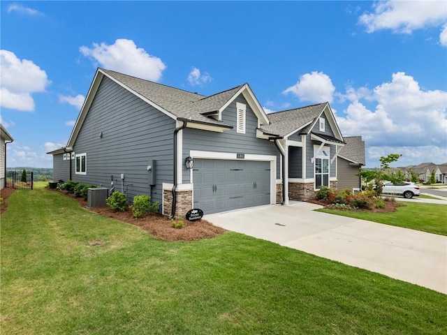 view of front of home featuring central AC and a front lawn