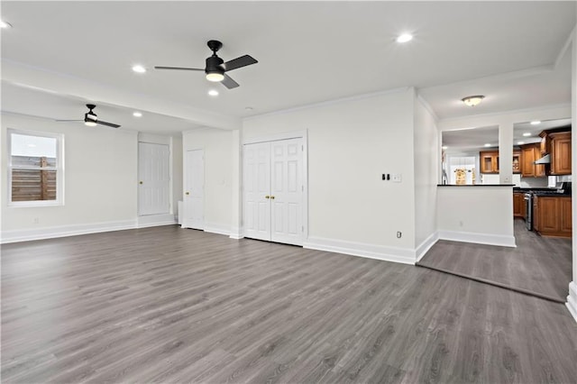 unfurnished living room featuring hardwood / wood-style floors and ceiling fan