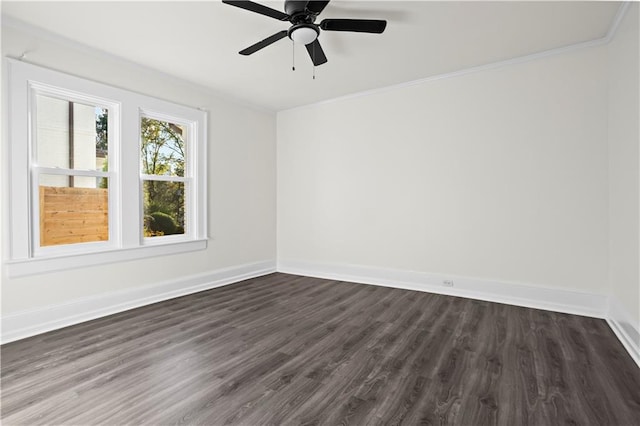 spare room with ceiling fan, dark hardwood / wood-style flooring, and ornamental molding