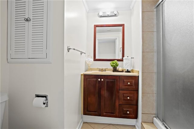 bathroom featuring tile patterned floors, vanity, ornamental molding, and walk in shower