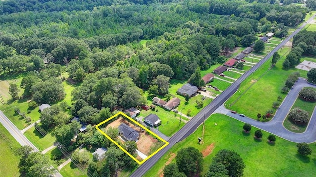 bird's eye view featuring a wooded view