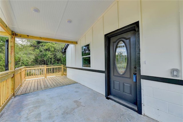 property entrance featuring concrete block siding