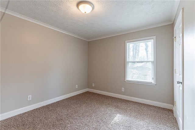 unfurnished room featuring ornamental molding, carpet, and a textured ceiling