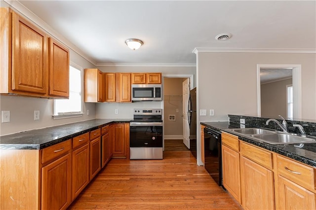 kitchen with crown molding, sink, light hardwood / wood-style floors, and black appliances