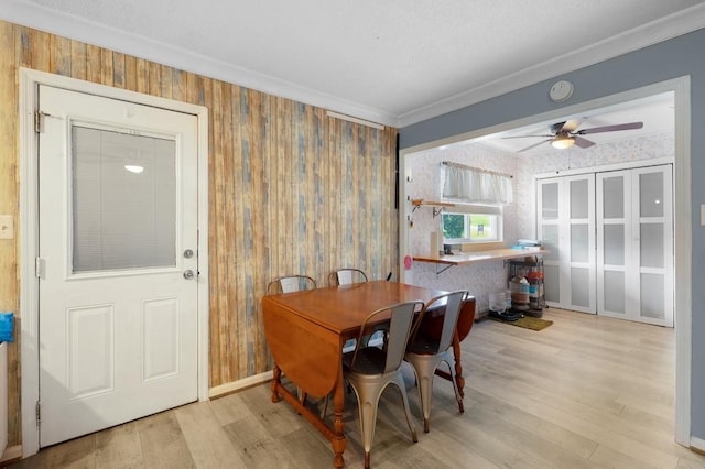 4223 Spring Valley Dr, Cohutta, GA 30710 - dining room featuring wood finished floors, ceiling fan, crown molding, and wallpapered walls