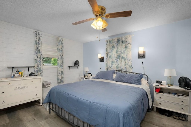 4223 Spring Valley Dr, Cohutta, GA 30710 - bedroom featuring wood finished floors, a textured ceiling, and a ceiling fan