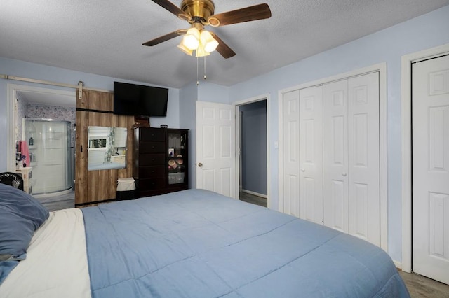 4223 Spring Valley Dr, Cohutta, GA 30710 - bedroom featuring a textured ceiling, a ceiling fan, and wood finished floors