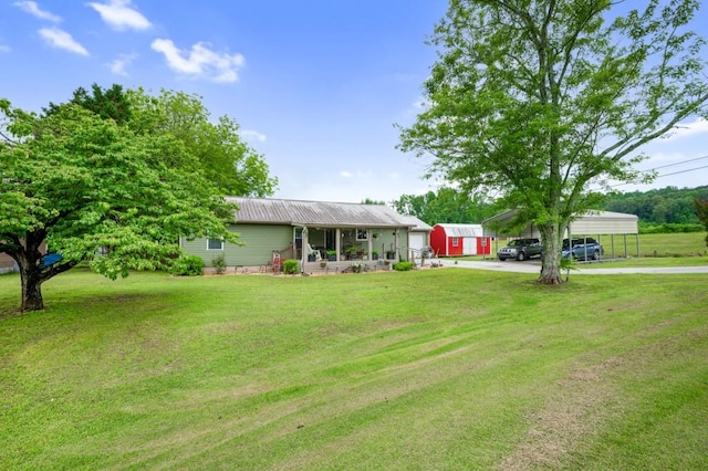 4223 Spring Valley Dr, Cohutta, GA 30710 - view of front of property featuring driveway, a carport, a front lawn, covered porch, and metal roof