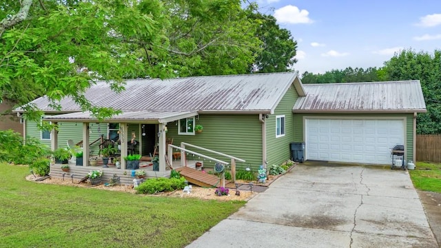 4223 Spring Valley Dr, Cohutta, GA 30710 - view of front of house with metal roof, concrete driveway, a front lawn, an attached garage, and a porch