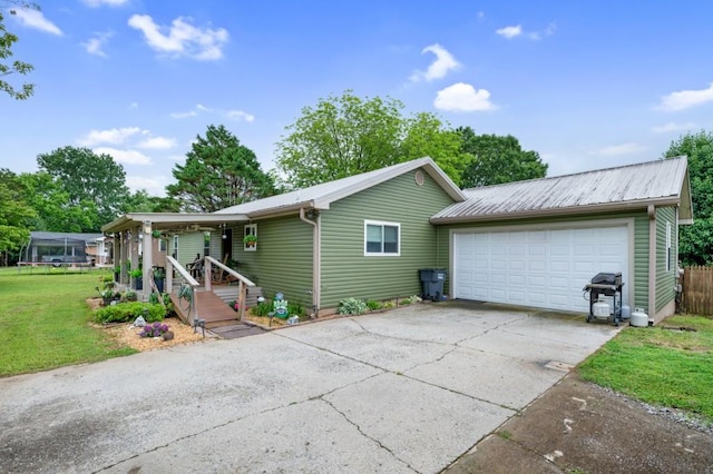 4223 Spring Valley Dr, Cohutta, GA 30710 - view of front of property with driveway, a front lawn, metal roof, and an attached garage