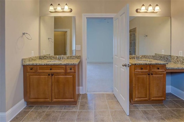 bathroom with vanity and tile patterned flooring