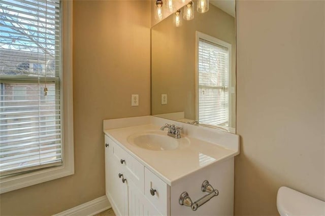 bathroom with vanity and toilet