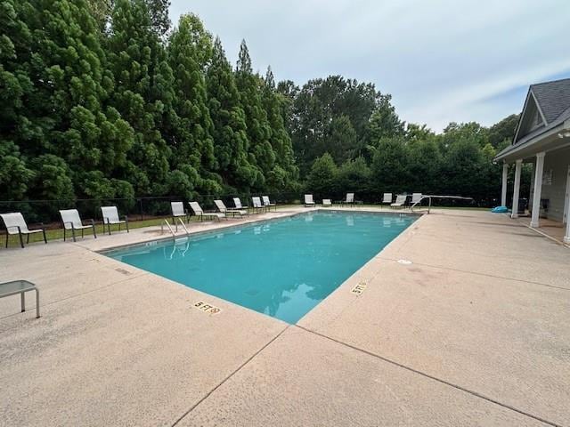 view of swimming pool featuring a patio area