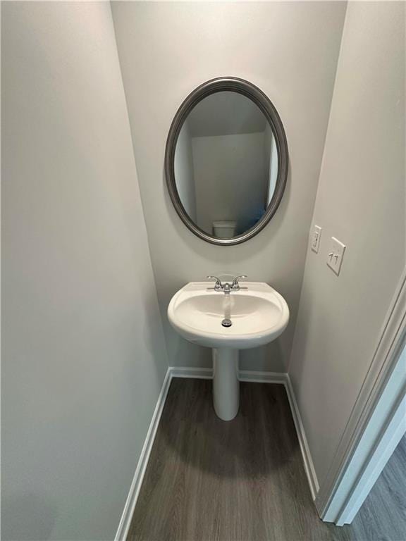 bathroom with sink and hardwood / wood-style floors