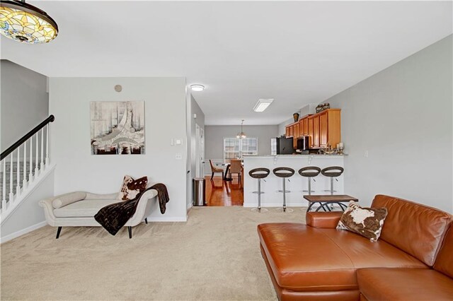 bedroom featuring hardwood / wood-style flooring, a raised ceiling, and ceiling fan