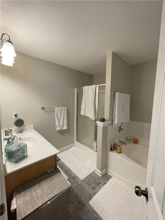 bathroom with vanity, tile patterned floors, and separate shower and tub