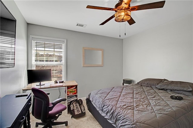 bedroom with carpet floors, visible vents, and a ceiling fan