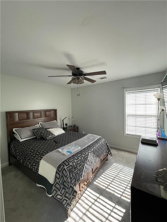 carpeted bedroom with ceiling fan