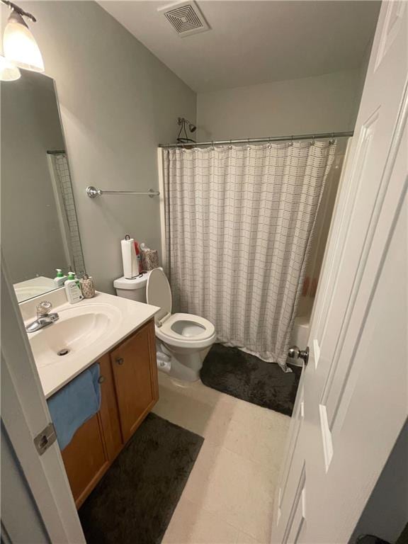 full bathroom featuring toilet, vanity, and shower / bathtub combination with curtain