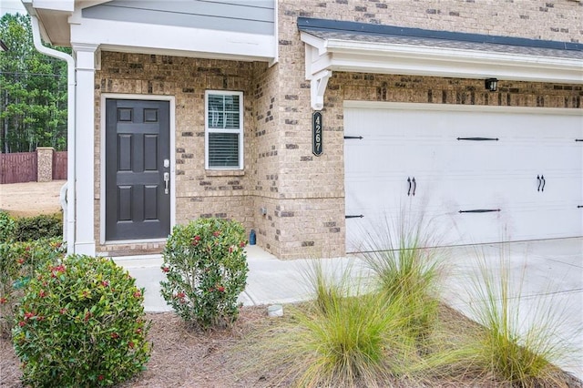 view of exterior entry featuring a garage