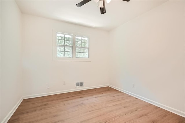 empty room featuring ceiling fan and light hardwood / wood-style flooring