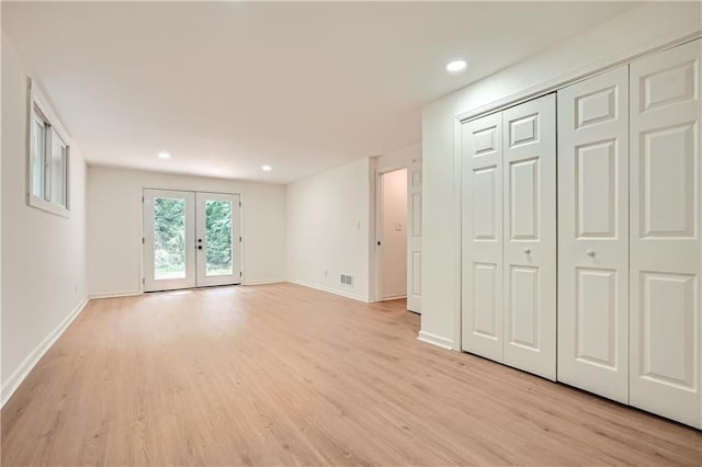 interior space featuring light wood-type flooring and french doors