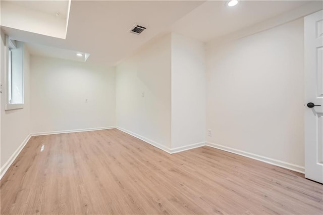 unfurnished room with light wood-type flooring